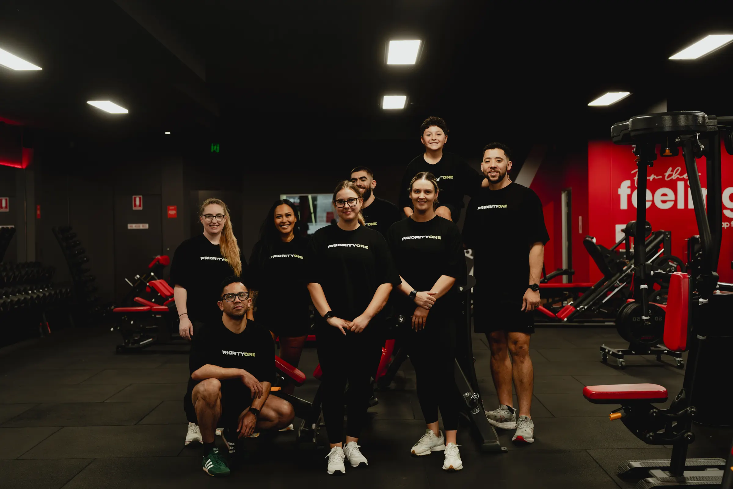 Priority One Performance coaches and clients together at the gym